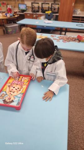 two students play Operation 