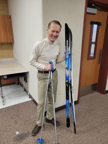 Mr. Ewell skiing to school