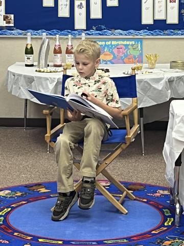 Owen reading the story he wrote 