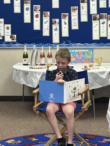 Another student reading the story he wrote 