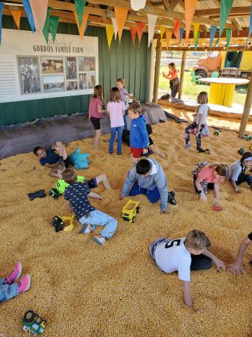 Students playing in the corn pit. 