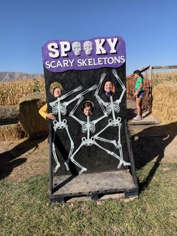 Students in a skeleton photo display 