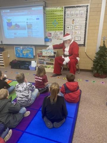 Santa reading to students 