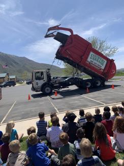 1st grade being visited by the garbage truck community helper